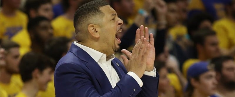 Head Coach Jeff Capel signals from the sideline while standing in front of the Oakland Zoo